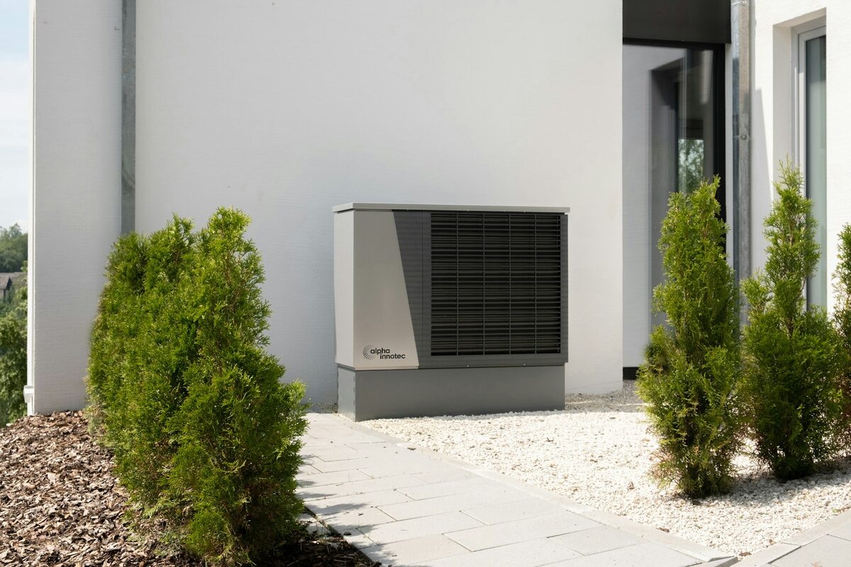 High-efficiency outdoor air conditioning unit installed beside a modern home