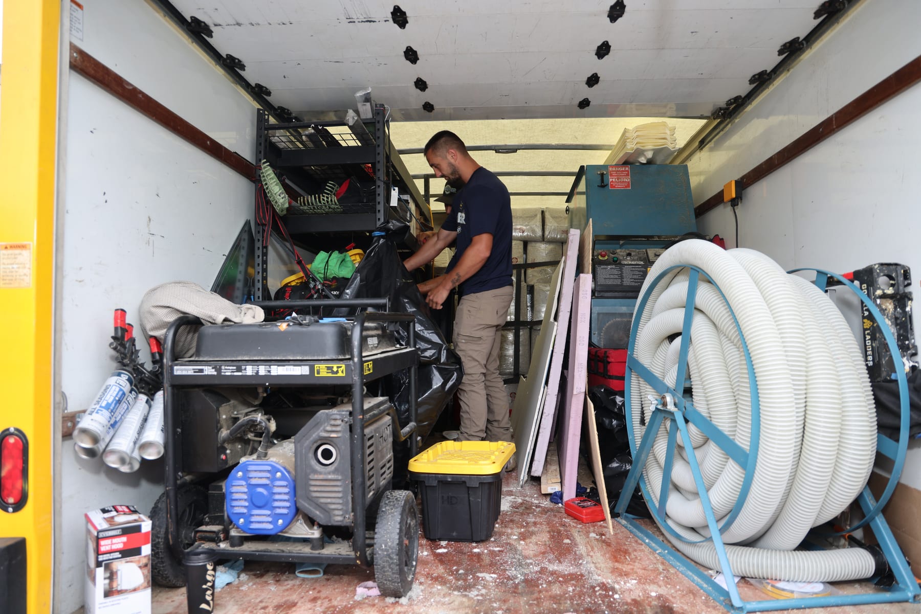All Weather Comfort Solutions insulation blowing rig loaded in a service truck